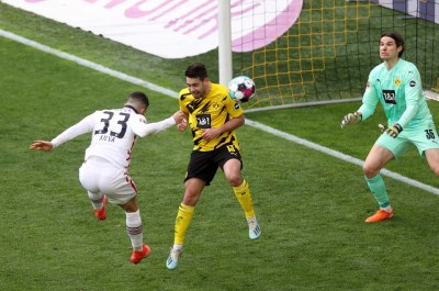 Soccer-Eintracht win at Dortmund to boost Champions League hopes